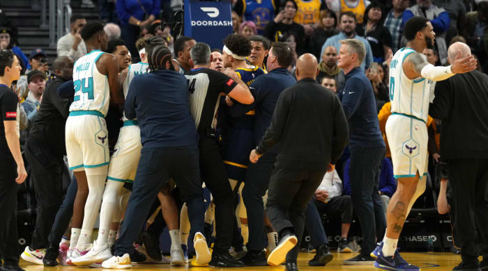 Members of the Golden State Warriors and Charlotte Hornets have to be separated at the end of a game.